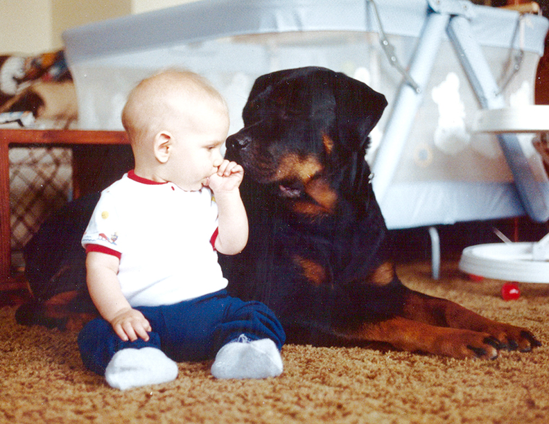 Philip and Chase sitting together in the living room.